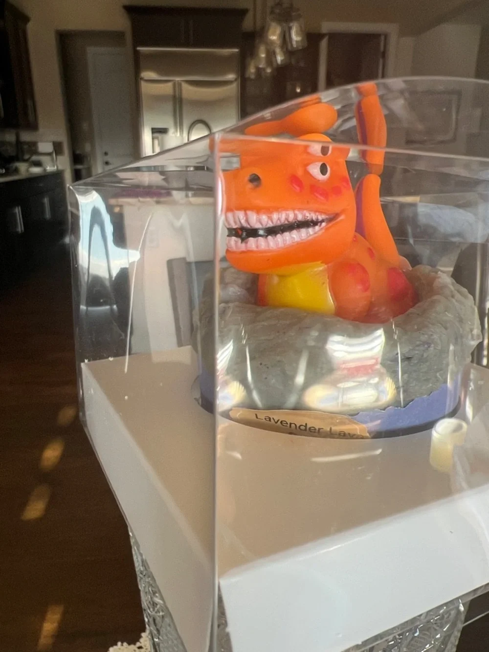 Hand Crafted Orange Dinosaur Bath Toy in Gray Nest